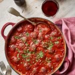 Marry me slow cooker meatballs in rich tomato sauce with fresh basil