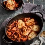 sweet potato and lentil curry with grilled halloumi in a pot